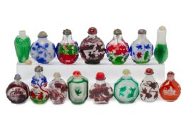 A GROUP OF FIFTEEN OVERLAID GLASS SNUFF BOTTLES