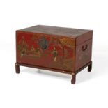 A CHINESE RED LACQUER TRUNK ON STAND