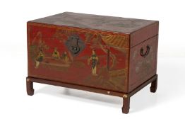 A CHINESE RED LACQUER TRUNK ON STAND