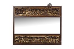 A CHINESE CARVED GILTWOOD WALL MIRROR