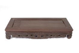 A CARVED RECTANGULAR STAND