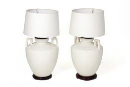 A PAIR OF WHITE PORCELAIN TABLE LAMPS