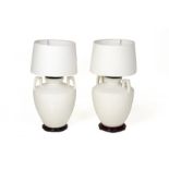 A PAIR OF WHITE PORCELAIN TABLE LAMPS