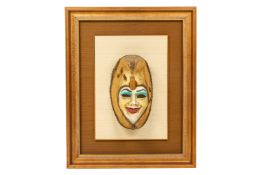 A FRAMED VENETIAN MASK