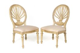 A PAIR OF CREAM PAINTED SIDE CHAIRS