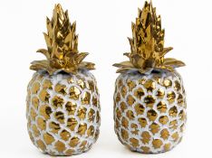 A PAIR OF METALLIC GLAZED CERAMIC PINEAPPLE ORNAMENTS