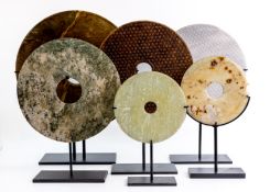 A GROUP OF SIX JADE / STONE DISCS