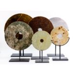 A GROUP OF SIX JADE / STONE DISCS