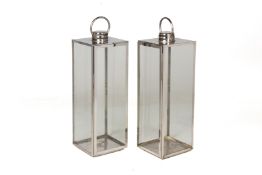 A PAIR OF LARGE CHROME FINISHED METAL AND GLASS LANTERNS