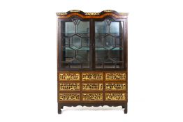 A GLAZED AND PARCEL GILT DISPLAY CABINET