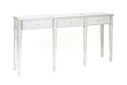 A MIRRORED AND SILVERED CONSOLE TABLE