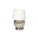 A SILVERED CERAMIC TABLE LAMP