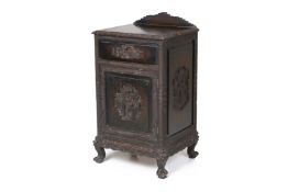 AN ORIENTAL CARVED WOOD BEDSIDE CABINET