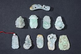 A GROUP OF TEN ASSORTED JADE CARVINGS AND PENDANTS