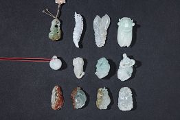 A GROUP OF 12 ASSORTED SMALL JADE CARVINGS