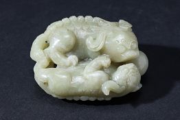 A NEPHRITE JADE CARVING OF LION CUBS