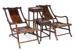 A PAIR OF BLACKWOOD RECLINING ARMCHAIRS AND TABLE