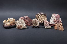 A GROUP OF EIGHT CHINESE STONE FIGURAL CARVINGS