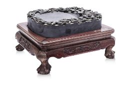 A LARGE CARVED INKSTONE ON STAND
