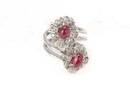 A CABOCHON RUBY AND DIAMOND 'TOI ET MOI' RING