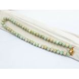 A GROUP OF THREE JADE BEAD SINGLE STRAND NECKLACES
