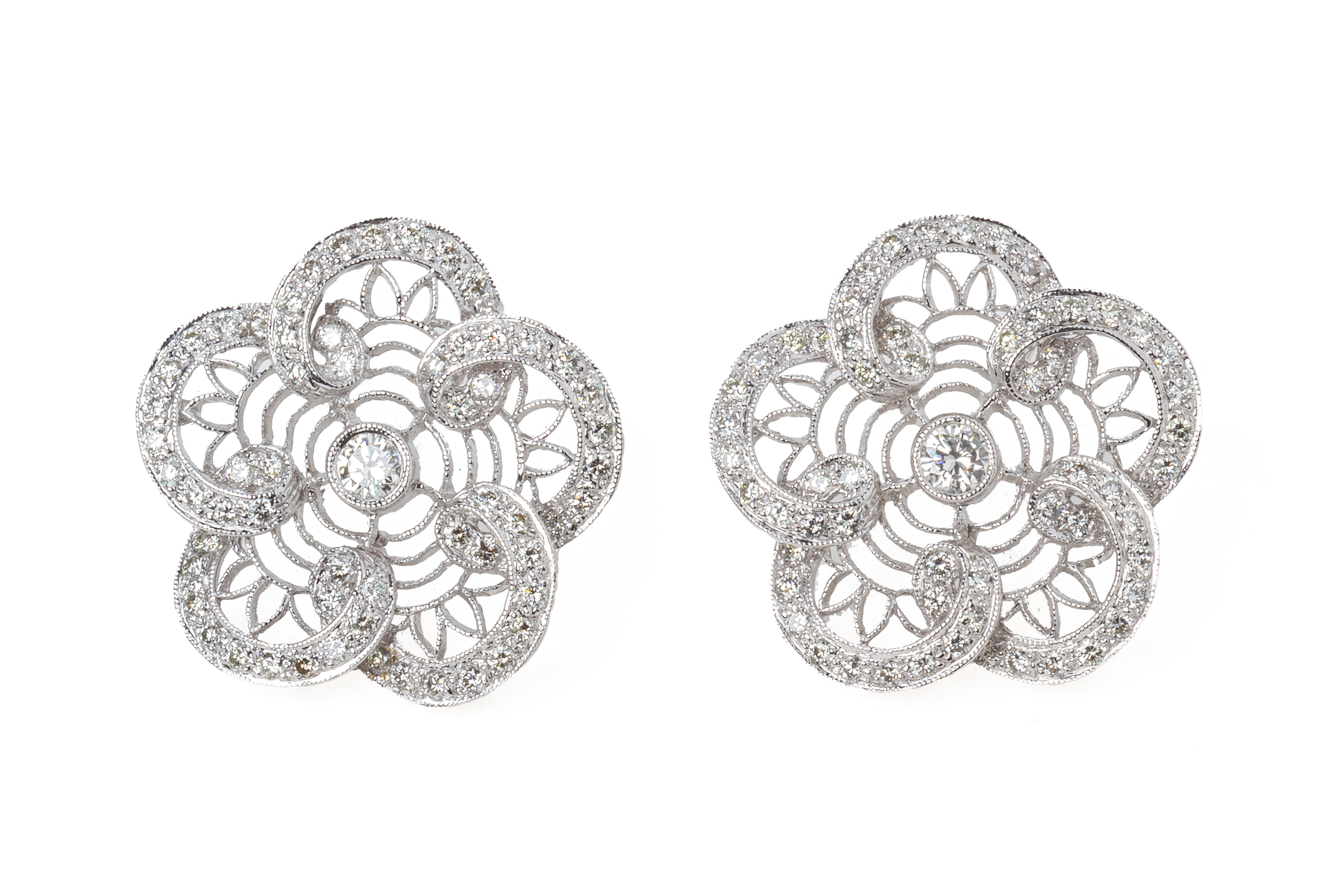 A PAIR OF DIAMOND FLOWERHEAD EARRINGS