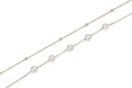 AN AKOYA CULTURED PEARL GOLD DOUBLE STRAND BRACELET