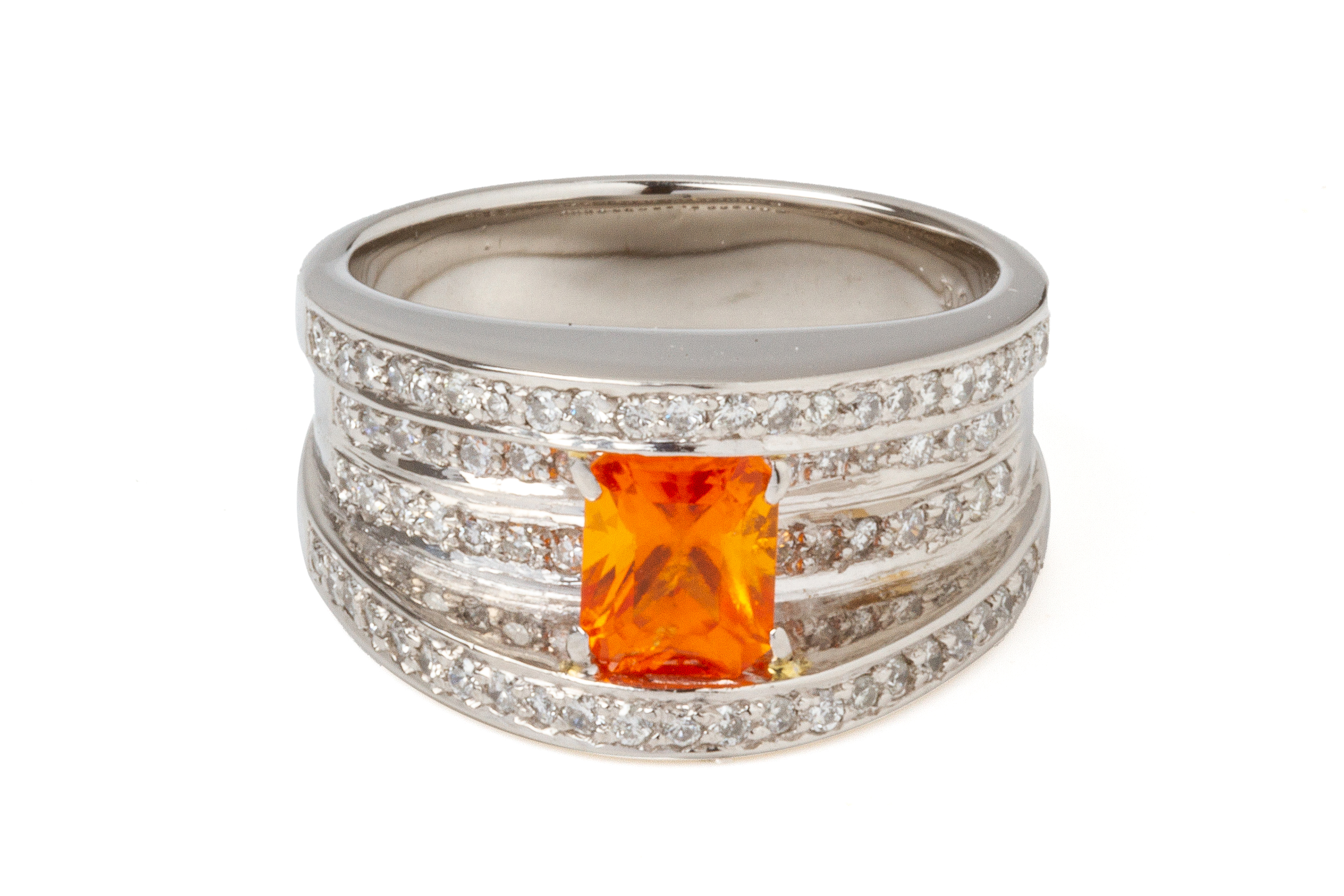 A SPESSARTITE GARNET AND DIAMOND RING