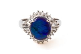 A BLACK OPAL AND DIAMOND RING