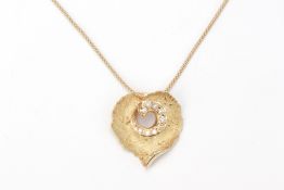 A HEART-SHAPED GOLD AND DIAMOND PENDANT ON CHAIN