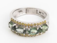 A GREEN SAPPHIRE AND YELLOW DIAMOND RING