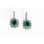 A PAIR OF EMERALD AND DIAMOND SCREWBACK EARRINGS