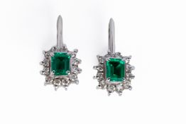 A PAIR OF EMERALD AND DIAMOND SCREWBACK EARRINGS