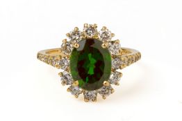 A CHROME DIOPSIDE AND DIAMOND CLUSTER RING