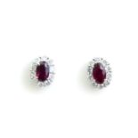 A PAIR OF RUBY AND DIAMOND STUD EARRINGS