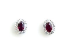 A PAIR OF RUBY AND DIAMOND STUD EARRINGS