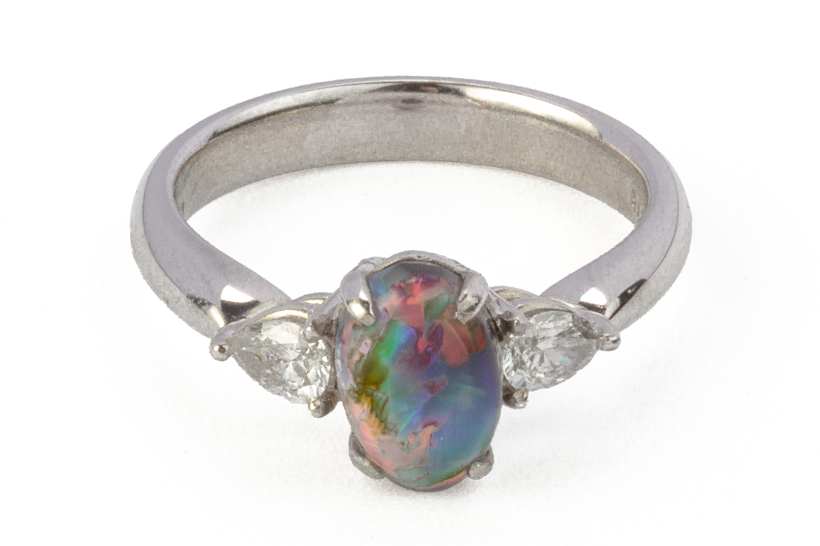 A BlACK OPAL AND DIAMOND THREE STONE RING