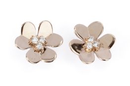 A PAIR OF GOLD AND DIAMOND FLOWER STUD EARRINGS