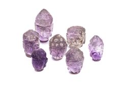 A GROUP OF LOOSE CARVED AMETHYST BUDDHA HEADS