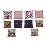 A GROUP OF TEN ASSORTED THROW CUSHIONS