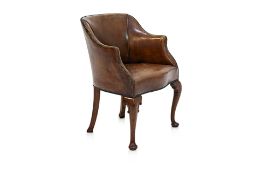 A GEORGE III STYLE LEATHER TUB CHAIR BY ARTHUR BRETT