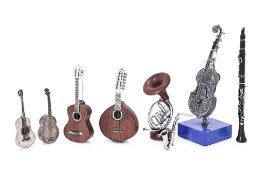 A GROUP OF 8 SILVER AND SILVER MOUNTED MINIATURE INSTRUMENTS