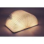 A LUMIO MULTI FUNCTIONAL PORTABLE BOOK FORM LAMP