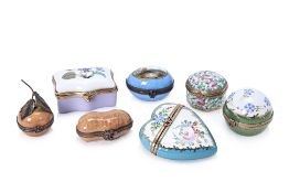 A GROUP OF SEVEN LIMOGES PORCELAIN PILL BOXES