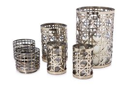 A GROUP OF SIX WOVEN METAL CANDLE HOLDERS
