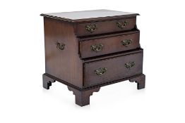 A SMALL GEORGE III STYLE MAHOGANY STEPPED CHEST OF DRAWERS