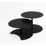 A PAIR OF OUTDOOR BLACK METAL NESTING COFFEE TABLES