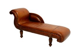 AN ANTIQUE SWEDISH LEATHER UPHOLSTERED WALNUT CHAISE LONGUE