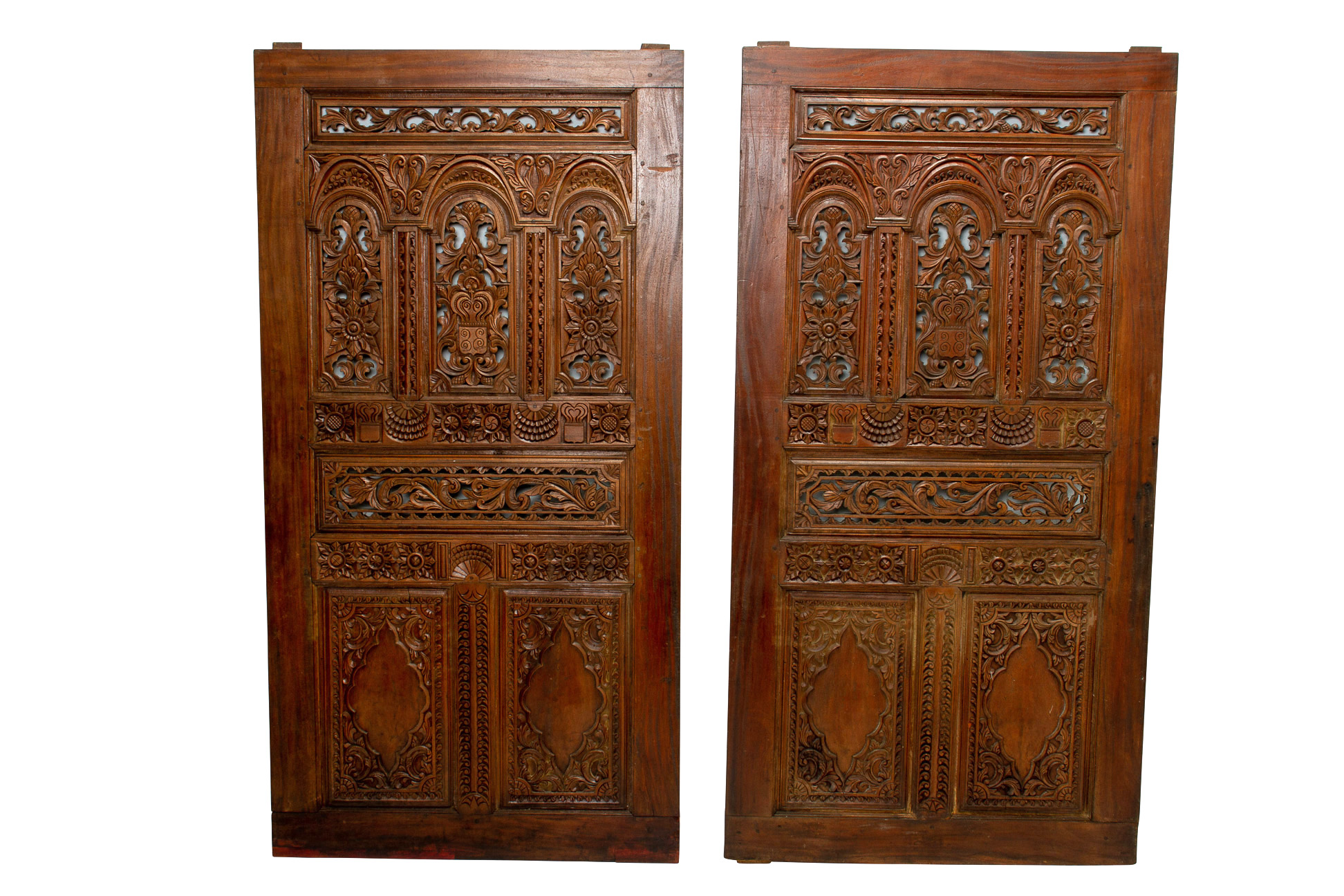 A PAIR OF LARGE CARVED TEAK DOORS