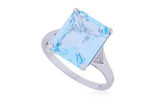 A BLUE TOPAZ AND DIAMOND RING